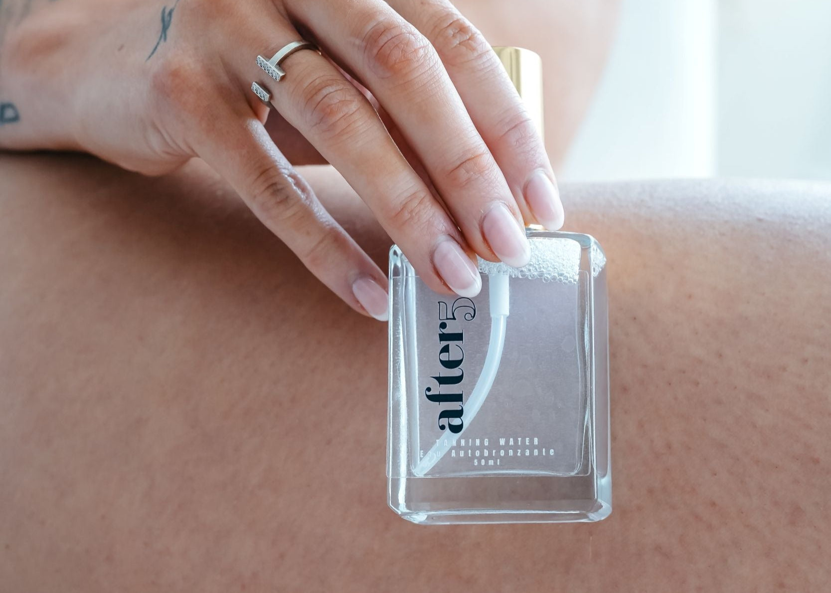 Holding sunless tanning water